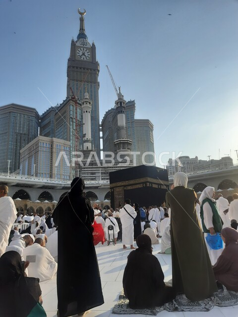 Royal Clock Tower Building, pilgrims near the Kaaba in the Holy Mosque in Mecca in the Kingdom of Saudi Arabia, a destination for Muslims from all over the world to perform worship and get closer to God, perform Hajj and Umrah rituals in Mecca, holy religious places