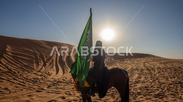 يوم بدينا 1727م, ذكرى تأسيس الدولة السعودية الأوى في 22 فبراير, اتباع تقاليد الأجداد في تربية الجياد, إحياء التراث السعودي التقليدي الشعبي, فارسة عربية خليجية سعودية ترتدي البرقع والعباءة السوداء تمتطي فرس بني أصيل, رفع علم المملكة في اليوم الوطني في 23 سبتمبر