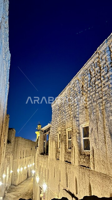 Old-style heritage stone buildings illuminated at night in the Sultanate of Oman, historical landmarks and tourist areas, a famous tourist attraction, Al-Rustaq Gate in the South Al Batinah Governorate