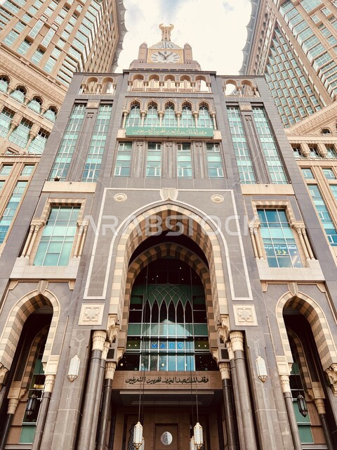 Worship and drawing closer to God, a close-up of the Royal Clock Tower building in Mecca, famous Islamic places and landmarks in the Kingdom of Saudi Arabia, the growth and urban progress of towers and skyscrapers, the architectural art of holy areas