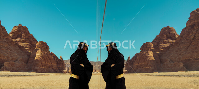  التكوينات والتشكيلات الصخرية في محافظة العلا السياحية, انعكاس جسم الشاب على مسرح مرايا في السعودية, يوم بدينا 1727م, ذكرى تأسيس الدولة السعودية الأولى في 22 فبراير, صورة من الجانب لرجل عربي خليجي سعودي يرتدي زي يوم التأسيس يستمتع في إحدى المعالم الأثرية