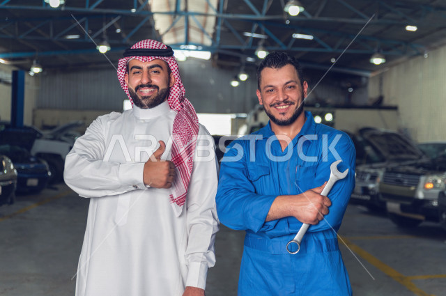 A Saudi Arab man stands with the mechanical engineer inside the auto workshop, with different face and hand gestures, car repair and maintenance services, a mechanical engineer, a maintenance workshop