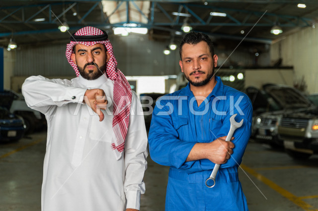 A Saudi Arab man stands with the mechanical engineer inside the auto workshop, with different face and hand gestures, car repair and maintenance services, a mechanical engineer, a maintenance workshop