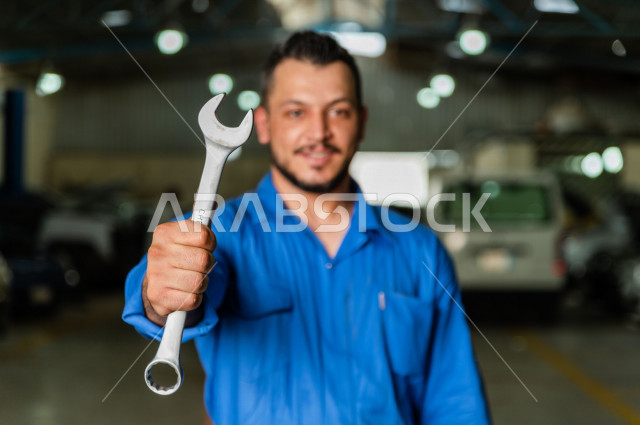 Mechanical engineer inside the car workshop, with different expressions and gestures of face and hands, use of tools for maintenance, manual repair, car repair and maintenance services, mechanical engineer, maintenance workshop