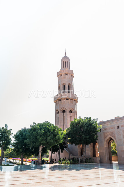 Attention to the cultivation of trees and plants in the Sultan Qaboos Great Mosque Square in the city of Nizwa in the Sultanate of Oman, holy religious tourism places, famous Islamic mosques and landmarks, inviting Muslims to pray, worship and draw closer to God, architectural art in Islamic style