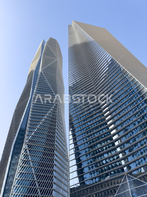 Economic and commercial facilities and buildings, Saudi urban development and progress, a picture from below of the King Abdullah Financial Center (CAFD) in the city of Riyadh, towers and skyscrapers, the ideal destination for finance and business with international standards, famous landmarks and places.