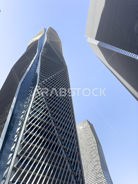 Continuing to develop and modernize the engineering designs of buildings, leading high-end companies in banking services and financial technology, a picture from below of the King Abdullah Financial Center (KAFD) in Riyadh, the Kingdom of Saudi Arabia, famous places and landmarks