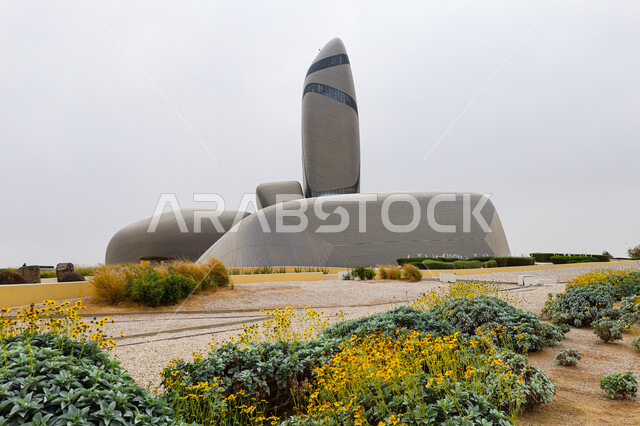 Flowers and green plants, an advanced cultural and scientific beacon, the King Abdulaziz Center for World Culture (Ithra) in the city of Dhahran in the Kingdom of Saudi Arabia, contemporary and modern architectural art, cultural tourism in Saudi Arabia