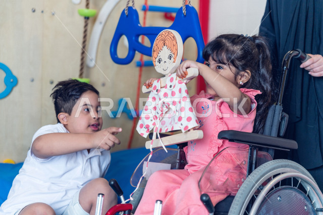 A Saudi Arabian kindergarten teacher specializing in caring for children with special needs, performing many fun activities for people of determination, integrating people with special needs in kindergartens and incubators