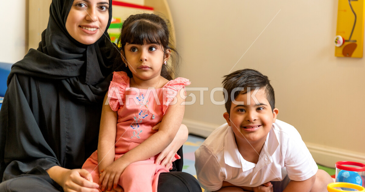 A Saudi Arabian kindergarten teacher specializing in caring for ...