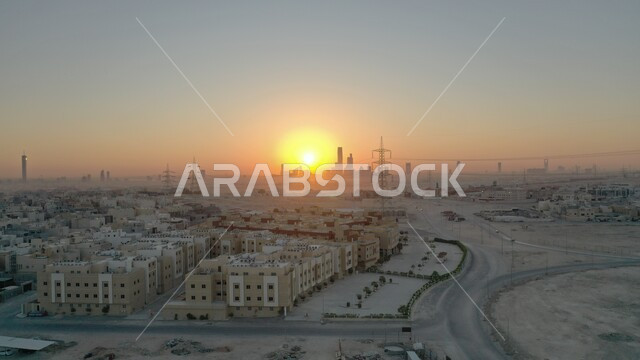Architectural engineering development, a building under construction, an aerial photo of a construction and contracting site in the Kingdom of Saudi Arabia at sunset, laying the foundation stone for building construction in the city of Riyadh, engineering professions and jobs