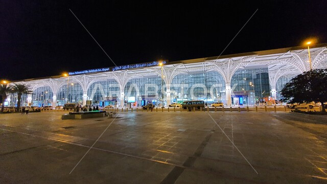 Reception and departure stations for tourists and Muslims in Medina, advanced architectural engineering for air and land travel facilities in the Kingdom of Saudi Arabia, the exterior facade of Prince Muhammad bin Abdulaziz International Airport at night