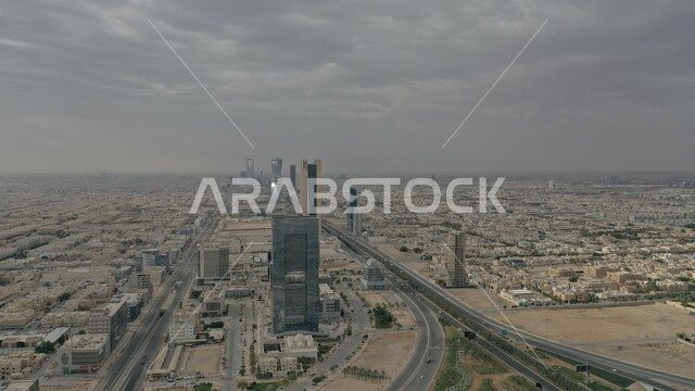 Transportation network and traffic on the roads and streets of the Kingdom of Saudi Arabia, modern architectural engineering art, the skyline of the city of Riyadh during the day, urban development and growth of residential and commercial facilities and buildings in the capital.