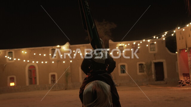 Lighting and decorations of old popular neighborhoods, remembrance of the Saudi National Day on September 23, a picture from behind of a Saudi Gulf Arab knight wearing traditional clothing holding the Kingdom’s flag proudly on Science Day on March 11, passion for equestrianism and practicing the hobby of horse riding