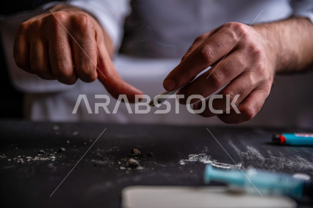 A young Saudi Arab fights the smoking habit, signs indicating stopping and caution from cigarette addiction, tobacco addiction, cigarette addiction, harmful and toxic substances abuse, harmful behavioral habits, no smoking