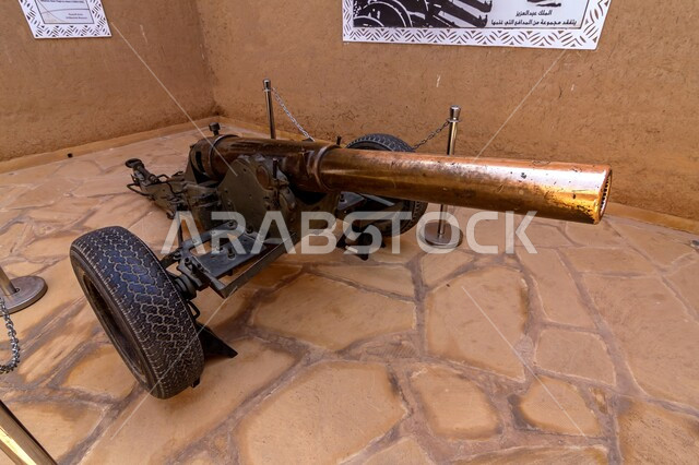 Monuments and tourist archaeological sites in Saudi Arabia, mud buildings and ancient buildings, nobility, authenticity and adherence to Saudi heritage, a close-up of a military artillery from inside the Masmak Palace Historical Heritage Museum in the city of Riyadh in the Kingdom.