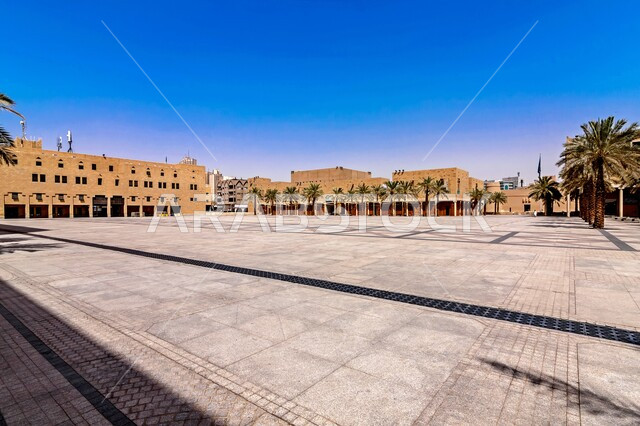 Monuments and tourist archaeological sites in Saudi Arabia, mud buildings and ancient buildings, nobility, authenticity and adherence to Saudi heritage, the historical status of Al-Safat Square in the Qasr Al-Hukm area in the city of Riyadh, green palm trees
