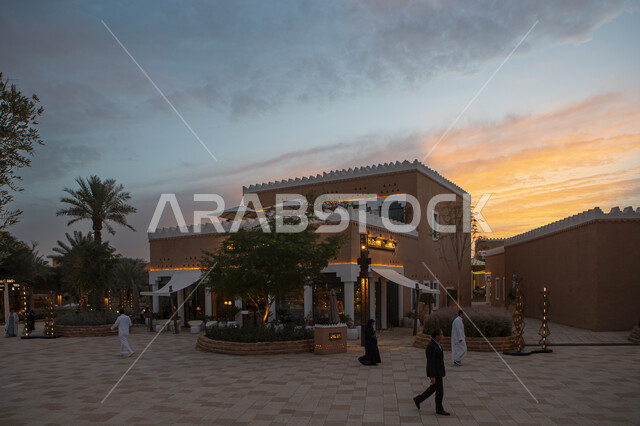 Enjoying the famous tourist attractions, ancient-style clay structures at sunset, authentic Saudi Arabian civilization, archaeological entertainment places during the day, the historic Diriyah development project, Al-Bujairi Overlook and Park in the Diriyah neighborhood in the city of Riyadh.