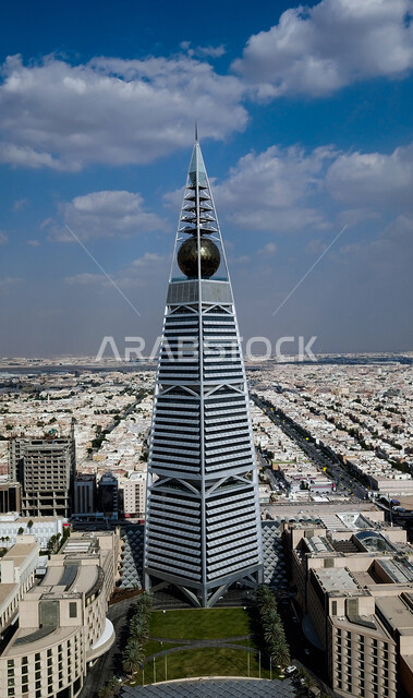 Urban growth and development in the capital, the architectural art of the Al-Faisaliah Tower in the city of Riyadh, an aerial photo of buildings and skyscrapers in the Kingdom of Saudi Arabia, famous tourist attractions