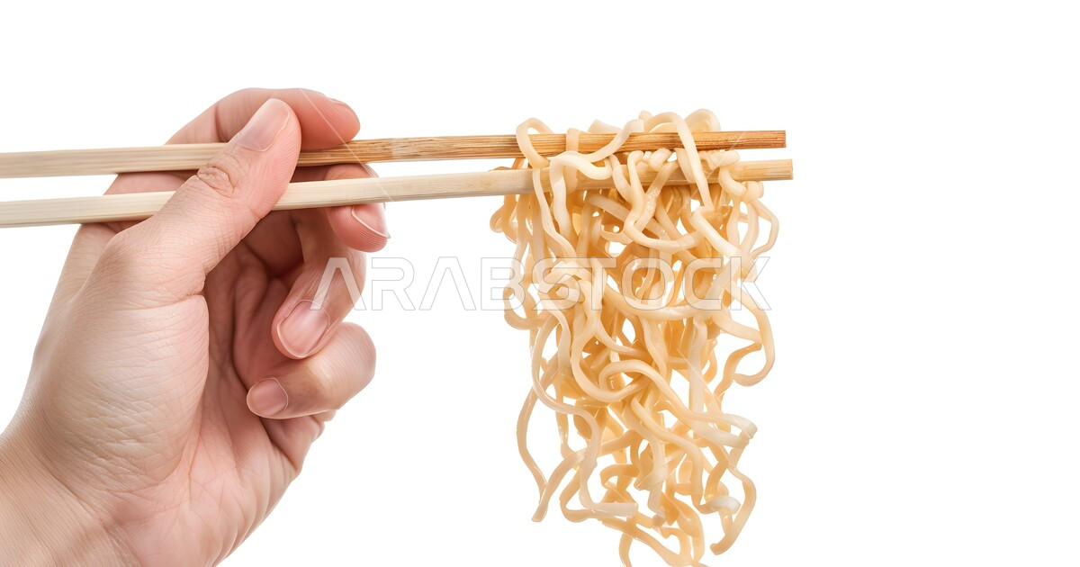 Using wooden chopsticks to eat pasta, Asian foods and cuisine, fast