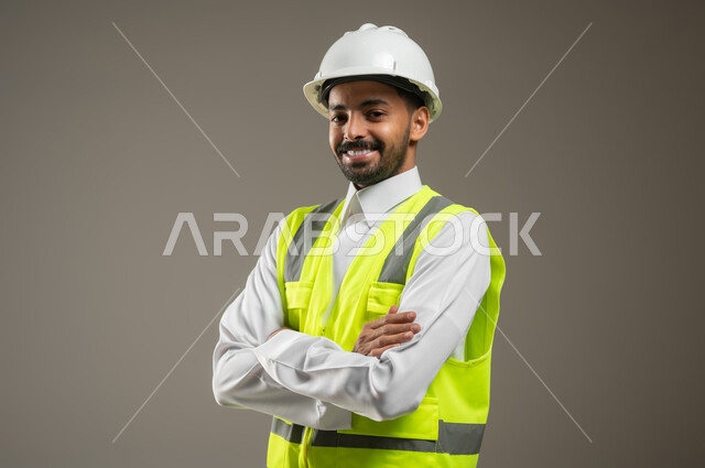Close-up portrait of a Saudi Arabian Gulf engineer wearing a safety ...
