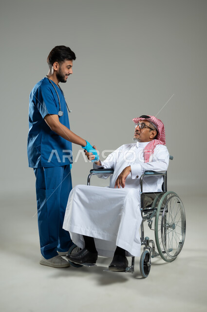 Receiving patients with smiles and a warm welcome, providing services to patients efficiently, the concept of medicine and health care, a close-up portrait of a nurse providing treatment to a Saudi Gulf man wearing a uniform on a wheelchair, full-length body image, gray background, sensitive content, sensitive use.