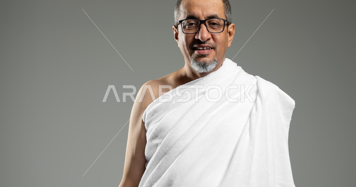 Performing Hajj and Umrah rituals, looking at the camera with gestures ...