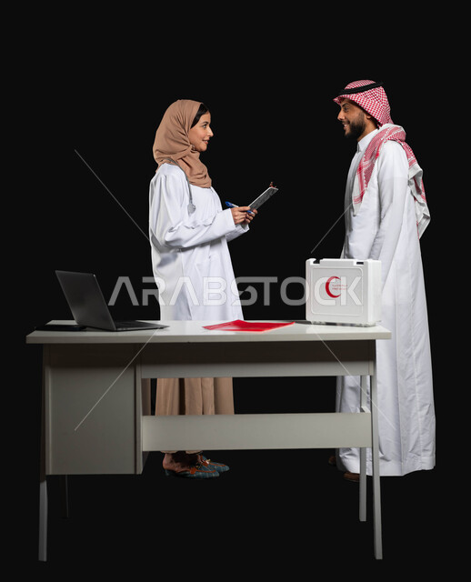 Working in the medical sector in Saudi Arabia, a portrait of a veiled Saudi Gulf Arab doctor explaining the health condition of a patient wearing a traditional thobe and shemagh, using a first aid kit, cheerful gestures in dealing with patients, full length body, black background, sensitive content, sensitive use
