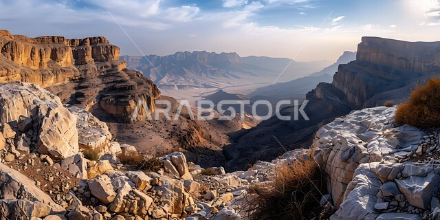 Valleys and rocky peaks in the prairies, ancient historical monuments, famous tourist places in the Kingdom of Saudi Arabia, the view of white clouds and clouds in the sky above desert natural reserves, mountain ranges and rock formations in desert areas.