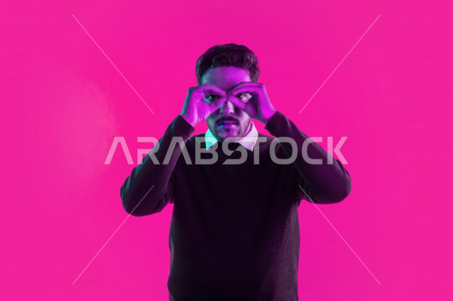 Portrait of a happy Saudi Gulf man, different face and hands gestures indicating happiness and joy, vitality and entertainment, colorful background