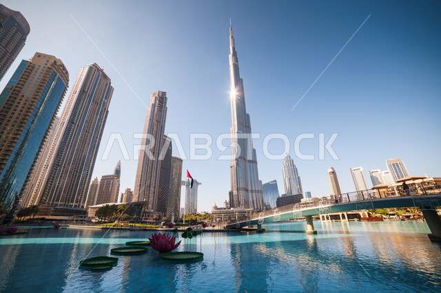 The architectural art of towers and skyscrapers, the waterfront of the Emirate of Dubai in the daytime, famous tourist attractions in the United Arab Emirates, commercial and residential facilities surrounding Burj Khalifa
