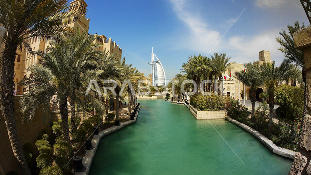 Interest in growing palm trees, recreational summer activities, Madinat Jumeirah in Dubai, luxury tourist resorts in the United Arab Emirates, attracting and attracting tourists from all over the world.