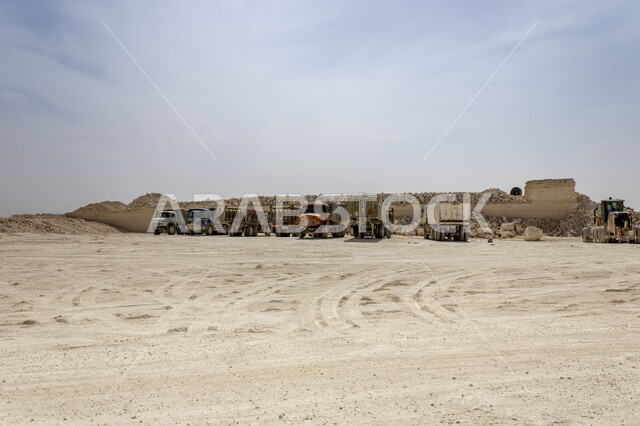 Mountain peaks and heights in desert areas, construction equipment at the construction site of the new Al-Qaddiyah sports, cultural and entertainment project, the future world entertainment and tourism capital in the Kingdom of Saudi Arabia