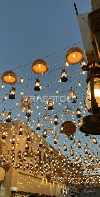 Streets and roads decorated with lights at night, a close-up of the illuminated hanging lanterns in the sky of Jeddah, celebration of Islamic religious occasions and holidays, Ramadan decorations and lights, famous tourist places and landmarks in the Kingdom of Saudi Arabia