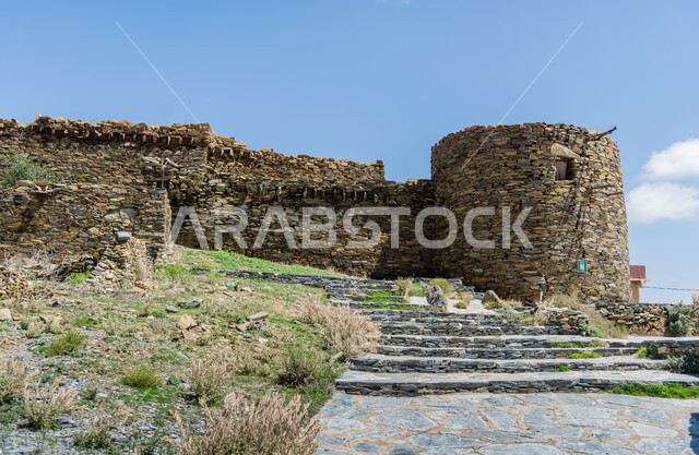Old-style architectural art, wild plants and herbs, traditional castles built of stones, Bakhroush bin Al-As Castle in the Al-Baha region, ancient stone houses and buildings, famous tourist attractions in the Kingdom of Saudi Arabia