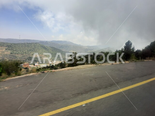 Highways traveling up the mountains of Asir, paved streets and roads, improving infrastructure in villages, mountain peaks and heights in the city of Abha, cities and natural tourist places in the Kingdom of Saudi Arabia.