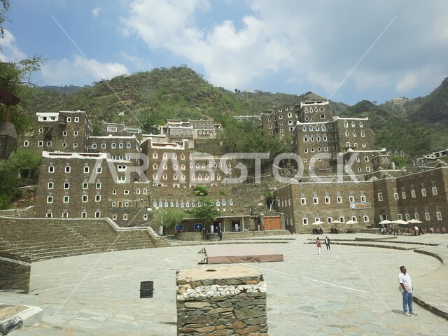 Architectural engineering art of old-style buildings in the city of Abha, famous landmarks and tourist places in the Kingdom of Saudi Arabia, the archaeological village of Rijal Almaa in the Asir region, stone buildings with wooden windows, attracting and attracting tourists from all over the world.