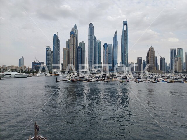 Architectural engineering art for buildings and facilities overlooking the sea, Dubai tourist attractions, growth, progress and urban expansion, the waterfront on the Arabian Gulf coast, towers and skyscrapers in the United Arab Emirates