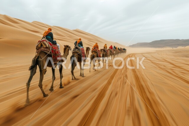 الإهتمام في تربية ورعاية الحيوانات، استخدام الإبل في التنقل في صحارى المملكة العربية السعودية، الرمال الذهبية الناعمة، مجموعة من الجمال تسير فوق الكثبان الرملية في الصحراء في وقت النهار، أماكن سياحية صحراوية