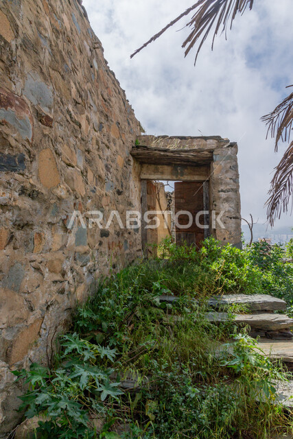 Green trees and plants, ancient architectural art, historical archaeological castles built of stones in the city of Al-Baha, stone houses and buildings in heritage villages, famous tourist attractions in the Kingdom of Saudi Arabia