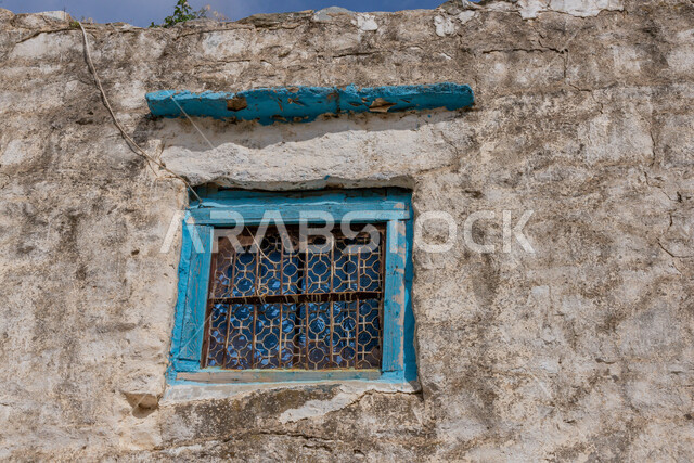 Historical archaeological castles built of stones in the city of Al-Baha, ancient-style architectural art, a close-up of windows in houses and stone buildings in heritage villages, famous tourist attractions in the Kingdom of Saudi Arabia