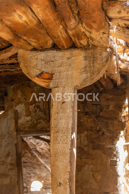 Wooden ceilings and columns, ancient architectural art, historical archaeological castles built of stones in the city of Al-Baha, stone houses and buildings in heritage villages, famous tourist attractions in the Kingdom of Saudi Arabia