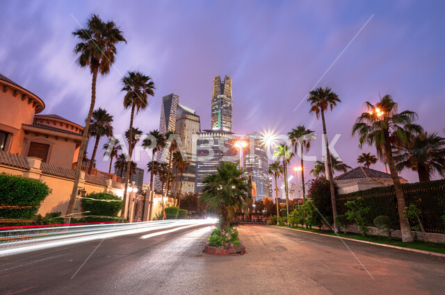 Distinctive architectural designs for economic towers and skyscrapers, leading high-end companies in banking and financial technology, the King Abdullah Financial Center (CAFD) in the Kingdom of Saudi Arabia, famous landmarks of Riyadh, paved roads and streets in the city of Riyadh at night