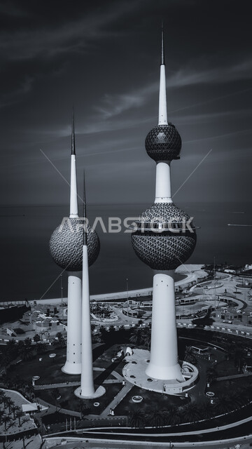Urban development and progress in the modern style, the architectural engineering art of Kuwait City towers, a black and white aerial photo of skyscrapers and facilities on the coast of the Arabian Gulf in the Ras Agouza area, famous tourist attractions