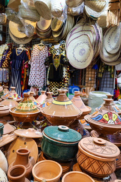 Pottery utensils and products made of clay, a store selling pottery utensils in the traditional popular market in the city of Abha in the Asir region, ancient traditional folk crafts and handicrafts in the Kingdom of Saudi Arabia, buying souvenirs and colorful and decorated pottery.