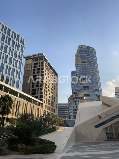 Urban development and growth in Saudi Arabia, King Abdullah Financial Center (KAFD) by day, financial facilities and towers in the city of Riyadh, architectural engineering of the famous buildings and skyscrapers in the Kingdom, achieving economic and commercial renaissance.