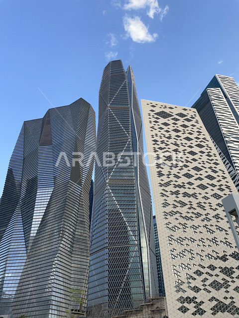 Urban development and growth in Saudi Arabia, King Abdullah Financial Center (KAFD) by day, financial facilities and towers in the city of Riyadh, architectural engineering of the famous buildings and skyscrapers in the Kingdom, achieving economic and commercial renaissance.