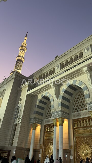 Interior decorations and designs in the Arab-Islamic style, the entry gate to the Prophet’s Mosque, performing prayers in the Prophet’s Mosque in Medina, worship and getting closer to God, sacred religious landmarks and places in Saudi Arabia.