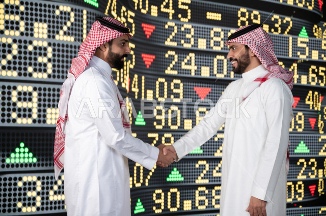رجال اعمال سعوديان خليجيان  يستخدمان البورصة و الاسهم لتطوير الأعمال و المشاريع ، ايماءات وجه و يدين تدل على الربح و صعود اسهم البورصة ، استخدام تقنية الجرافيكس في عرض نزول و صعود الاسهم  ، أخبار عالمية اقتصادية ،نشرة الإحصاءات الاقتصادية للدول العربية