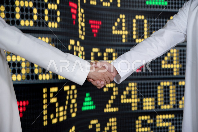 رجال اعمال سعوديان خليجيان  يستخدمان البورصة و الاسهم لتطوير الأعمال و المشاريع ، ايماءات وجه و يدين تدل على الربح و صعود اسهم البورصة ، استخدام تقنية الجرافيكس في عرض نزول و صعود الاسهم  ، أخبار عالمية اقتصادية ،نشرة الإحصاءات الاقتصادية للدول العربية